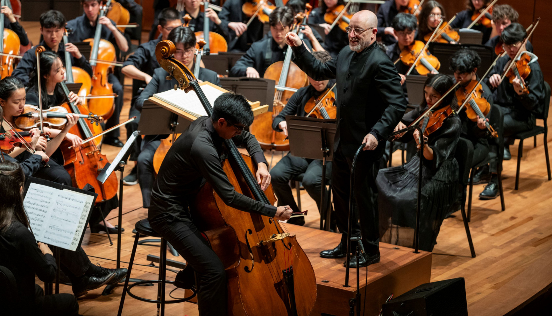 CUO Spring 2025 Concert at Alice Tully Hall. Bass soloist Eugene Zhang with Maestro Jeffrery Milarsky